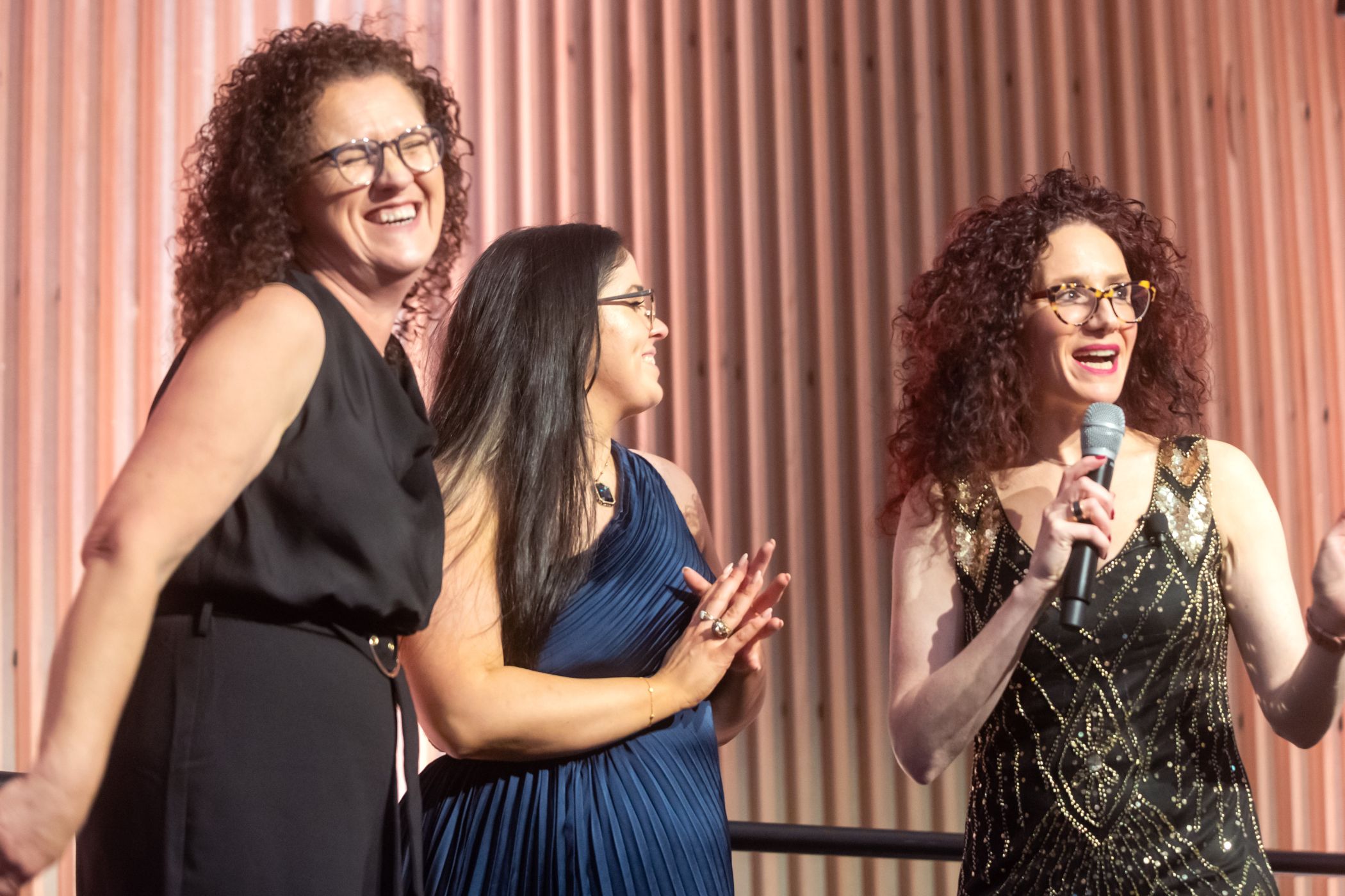 Guests laughing on stage with Jordana Borensztajn